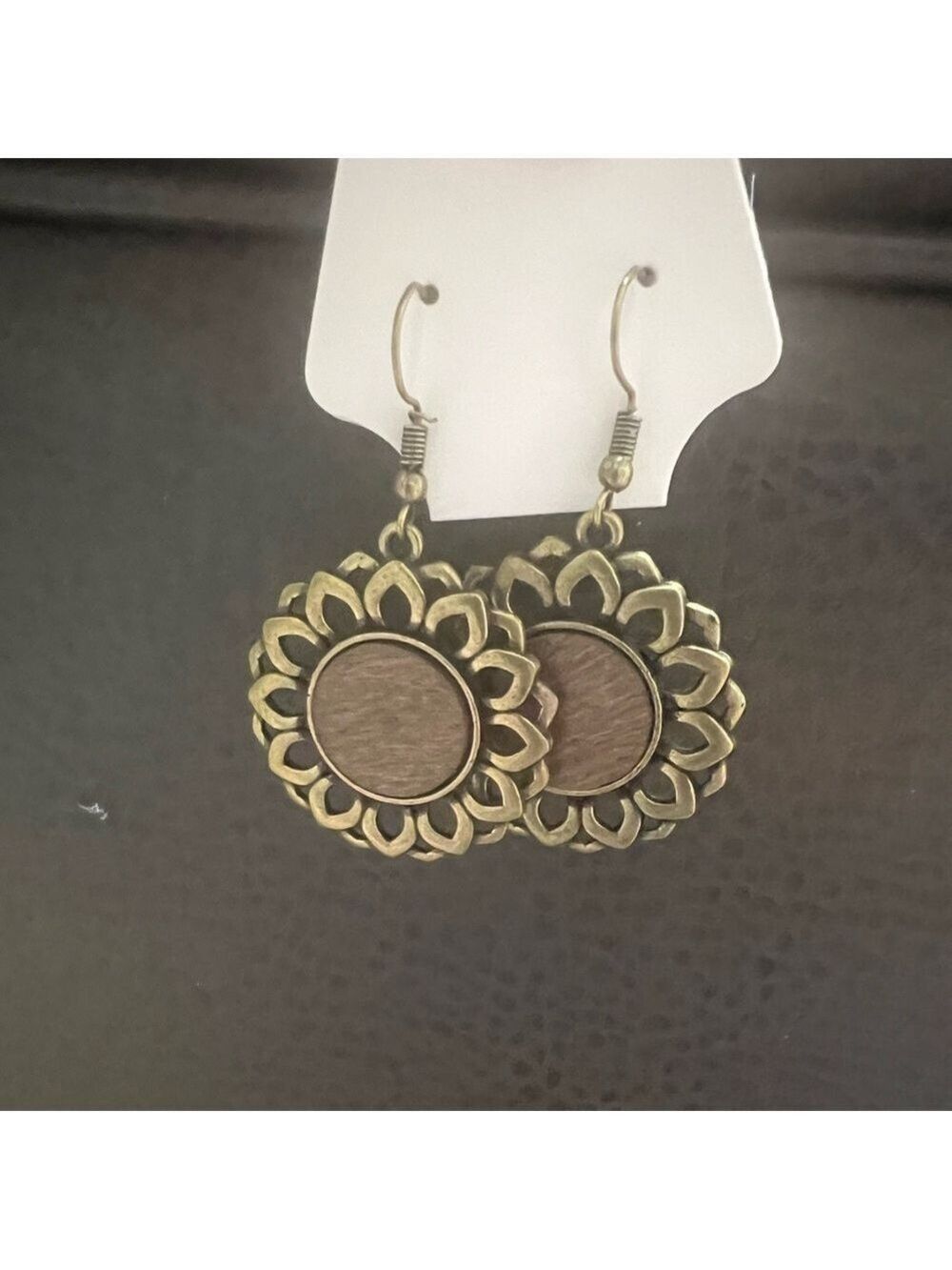 FASHION JEWELRY Copper colored flower with brown wooden circle in middle